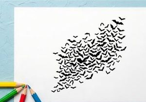 Flock of bats flying in the night sky for Halloween or wildlife scene
