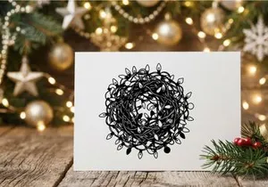 Tangled string of Christmas fairy lights isolated on a white background