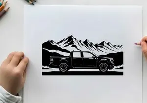 Silhouette of a pickup truck in front of a mountain range silhouette