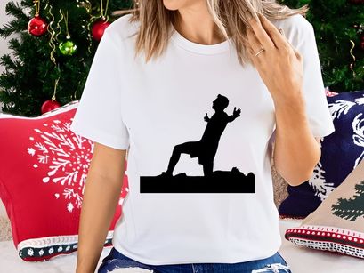 A silhouette of a man in a dynamic yoga pose outdoors