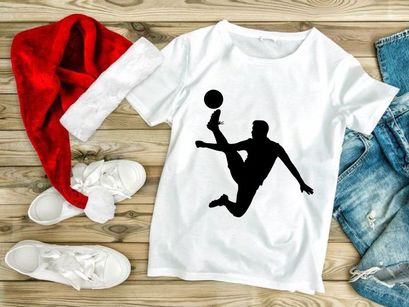 Silhouette of a soccer player kicking a ball in mid air motion with dynamic movement