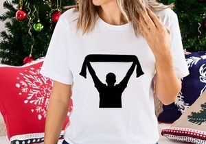 A person holding up a scarf in the air with both hands