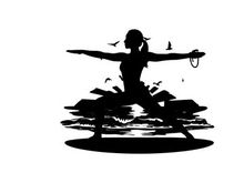 Silhouette of a woman practicing yoga at sunset beach
