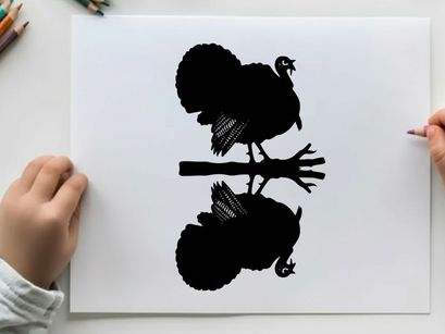 Silhouette of a turkey on a tree branch at night