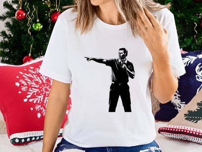 A man in a black shirt pointing to the left with a microphone