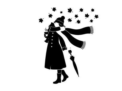 Silhouette of a person holding a lantern and umbrella