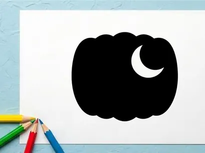 Silhouette of a pumpkin with a crescent moon in the night sky