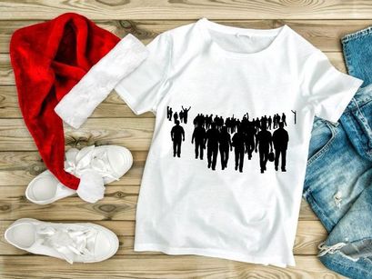 Silhouette of a large group of people walking together in unity and protest