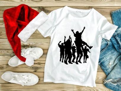 Silhouette of a group of people playing rugby with a ball