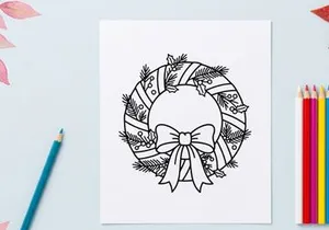 Hand-drawn Christmas wreath with silver bow and pine cones for festive holiday decor