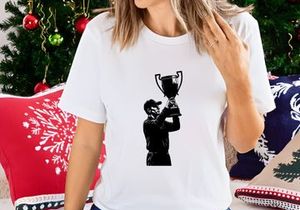 Victorious golfer holding trophy cup in triumphant pose