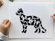 Silhouette of a dog in a standing position profile view