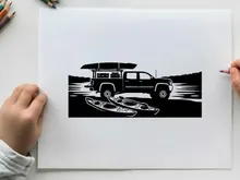 Silhouette of a pickup truck with kayaks on a serene lake shore