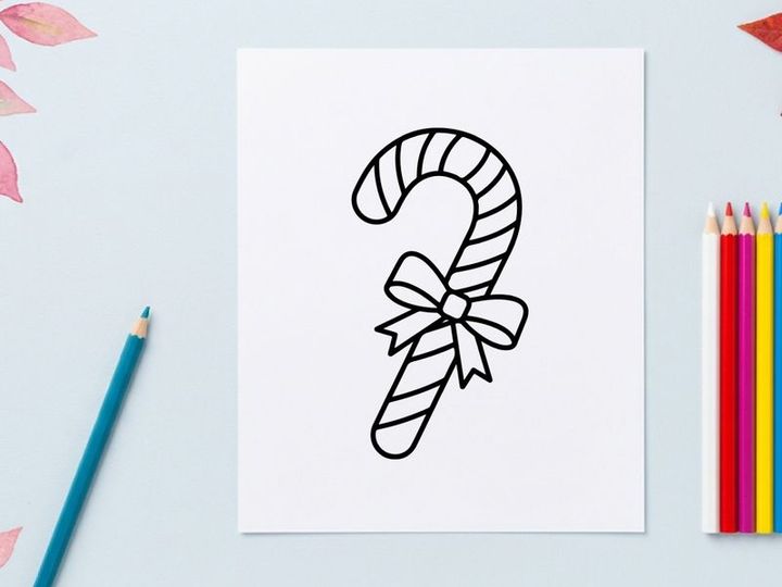 Christmas candy cane line art icon with a decorative bow for holiday design projects