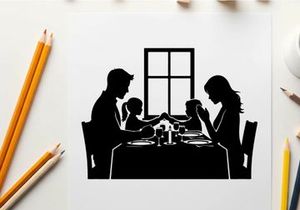 Family dinner in silhouette by the window