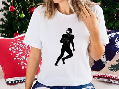 American football player in motion running with ball