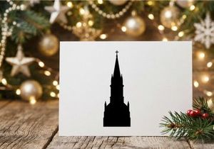 Black silhouette of a church steeple with a cross isolated on a white background