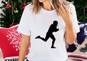 American football player running with ball in hand silhouette