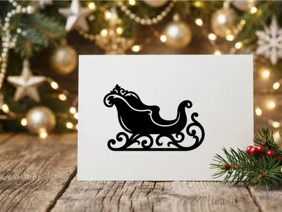 Black silhouette of a decorative Christmas sleigh isolated on a white background