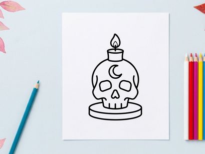 Skull candle holder with lit flame for Halloween decor. Spooky ceramic skull-shaped candle accessory for festive home styling.