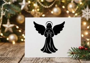 Silueta negra de un ángel en oración con alas y halo aislado sobre fondo blanco