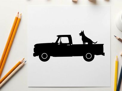 Silhouette of a dog sitting in the back of a pickup truck