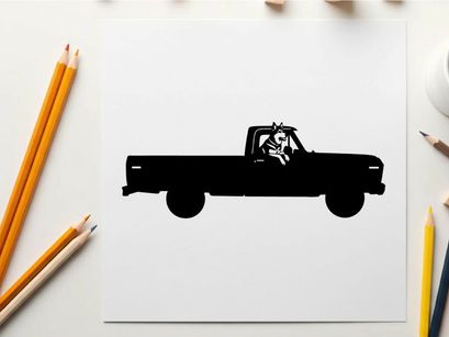 Silhouette of a pickup truck with a dog
