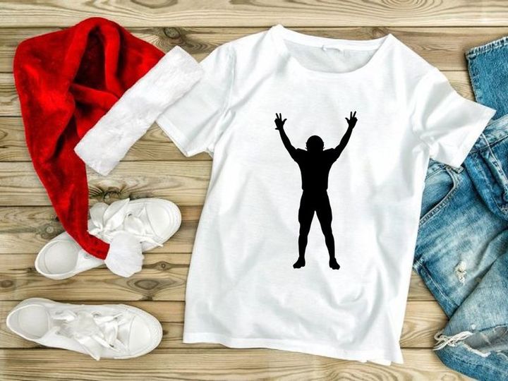 Silhouette of a person with arms raised in celebration or triumph