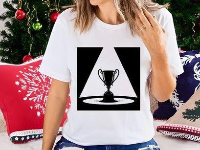 A shining trophy cup on a pedestal under a spotlight beam in darkness