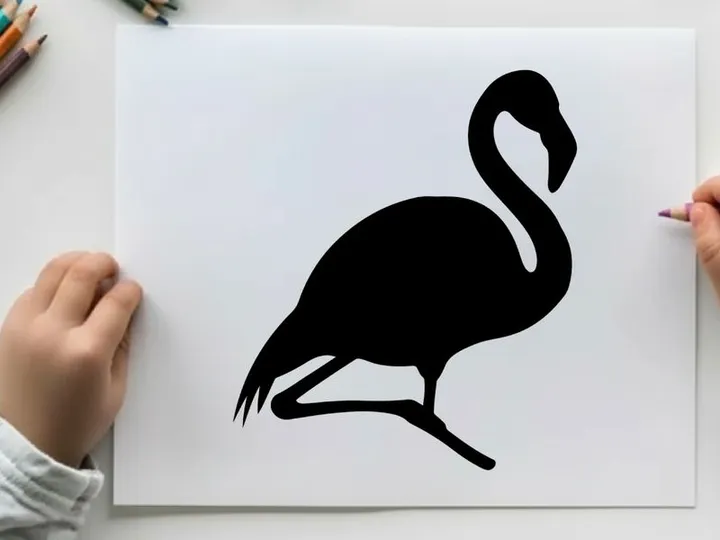 Silhouette of a flamingo standing on one leg