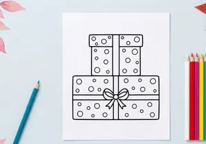 Three stacked Christmas gift boxes with polka dots and decorative bow for holiday celebration