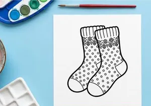 Pair of Christmas socks with polka dot and snowflake pattern line art illustration