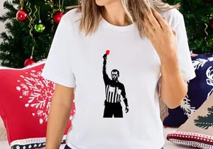 Referee holding a red card in a sports game for penalty or ejection