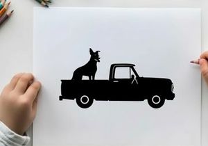 Silhouette of a dog sitting in the back of a pickup truck