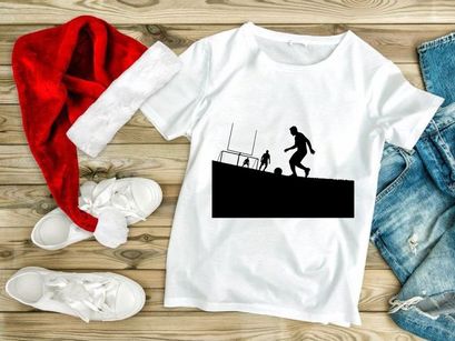 Silhouette of soccer players in action on a field with goalpost