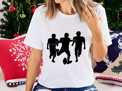 Three silhouette football players in action running with ball