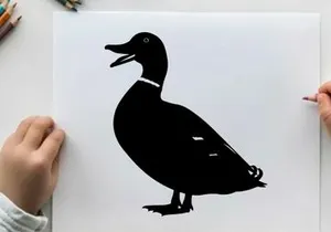 Silhouette of a duck with open beak on white background