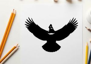Silhouette of a bird in flight with outstretched wings