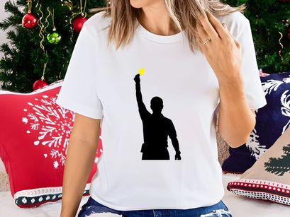 A silhouette of a man holding up a glowing yellow light source in his right hand