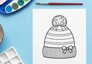Hand-drawn striped winter knit beanie with snowflake bow for festive holiday gift wrapping
