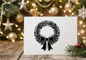 Black and white Christmas wreath illustration with pine cones and a decorative bow