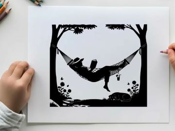 Silhouette of a person relaxing in a hammock between trees preview picture