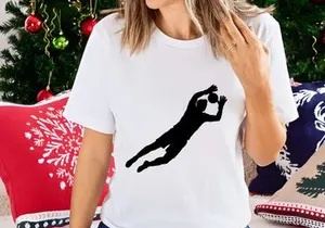 Silhouette of a person diving to hit a ball