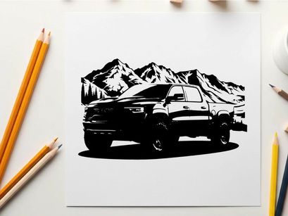 Silhouette of a pickup truck in front of snowy mountains