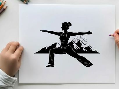 Silhouette of woman in yoga pose with mountain range silhouette
