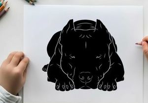 Silhouette of a dog lying down in a relaxed position