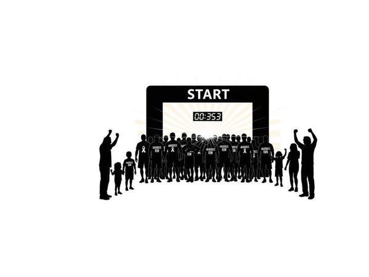 Silhouette of people at the start line of a race or marathon