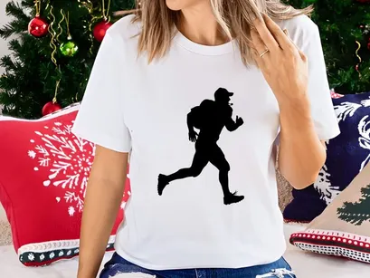 Silhouette of a man running with a backpack on in a dynamic pose