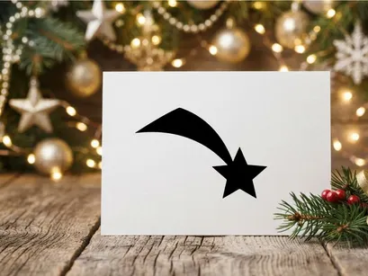 Ícone de estrela cadente preta isolada em fundo branco para design de Natal e feriados.