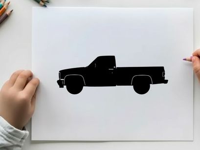 Silhouette of a classic pickup truck against a white background